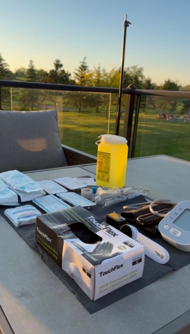 A Drip Tonic RN's single-use IV setup laid out on a balcony overlooking a golf course at sunset, ready for a mobile IV drip in the GTA.