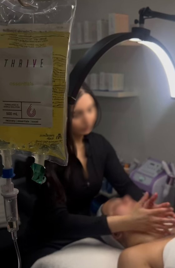 Anita's giveaway session — her facial under the lamp with her Drip Tonic IV running beside her.